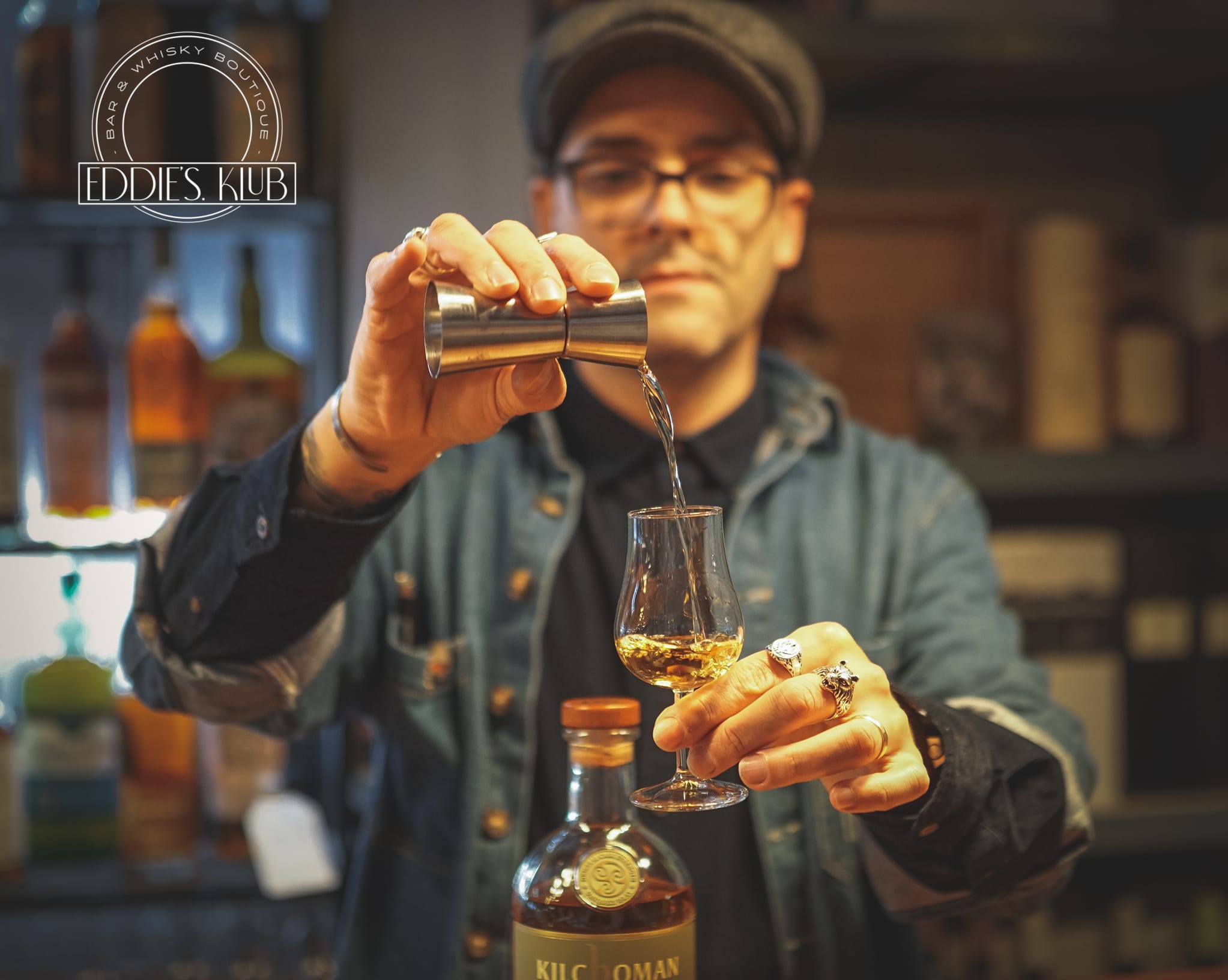 Eddie pouring whisky in a tasting glass